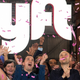 Lyft co-founders John Zimmer, front second from left, and Logan Green, front second from right, cheer as they as they ring a ceremonial opening bell in Los Angeles.